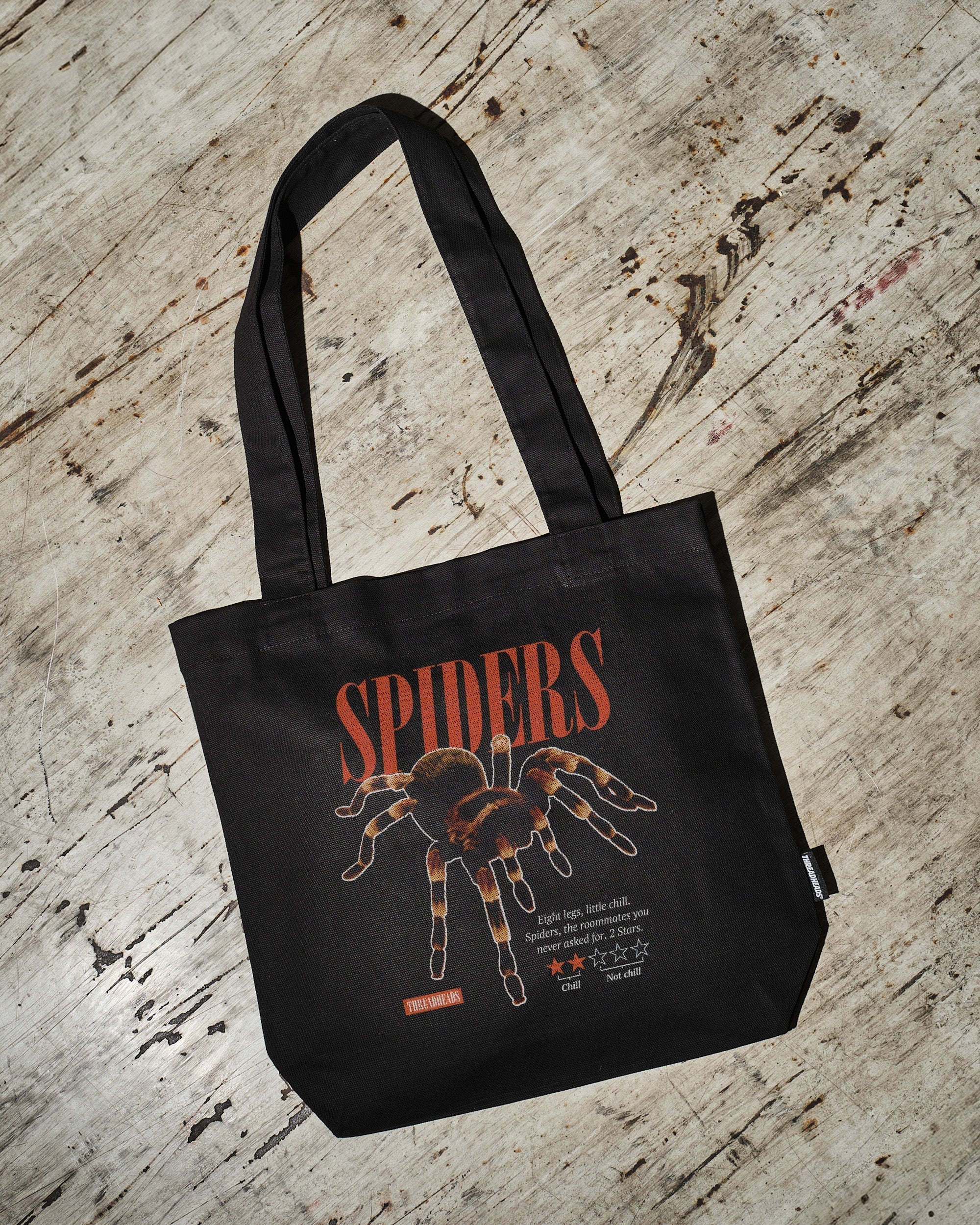 Spiders: A Review Tote Bag